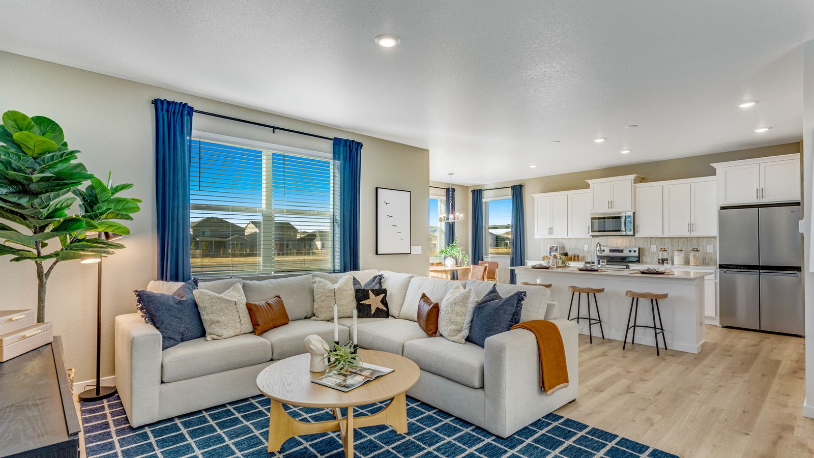 Spacious great room with open-concept design connecting seamlessly to the kitchen and dining area.