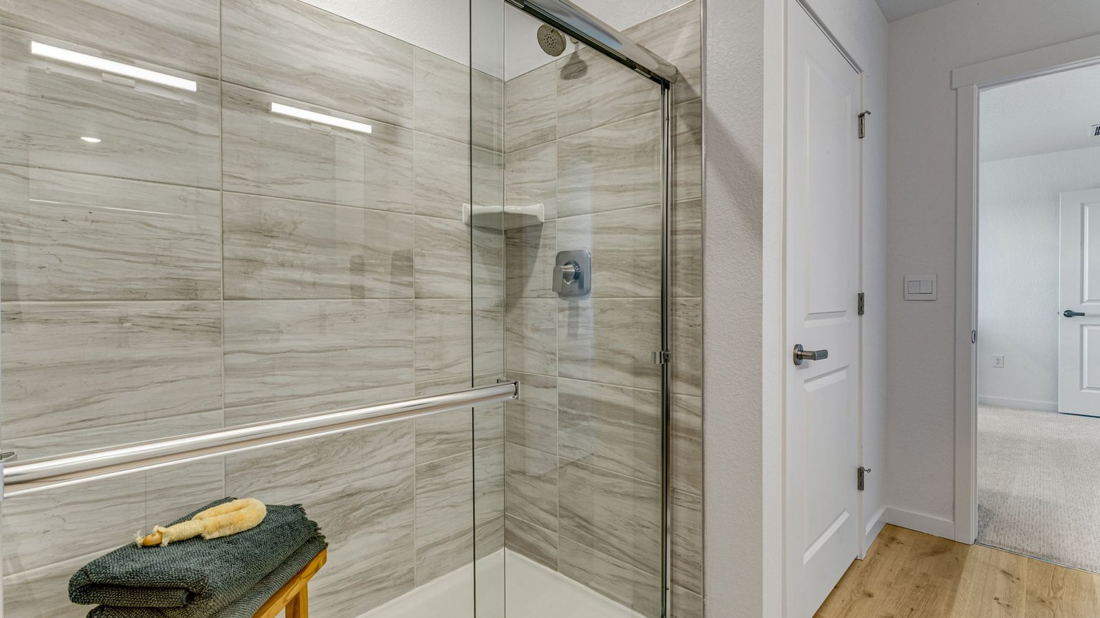 Owner's bath featuring dual vanities, a private water closet, and spacious design.