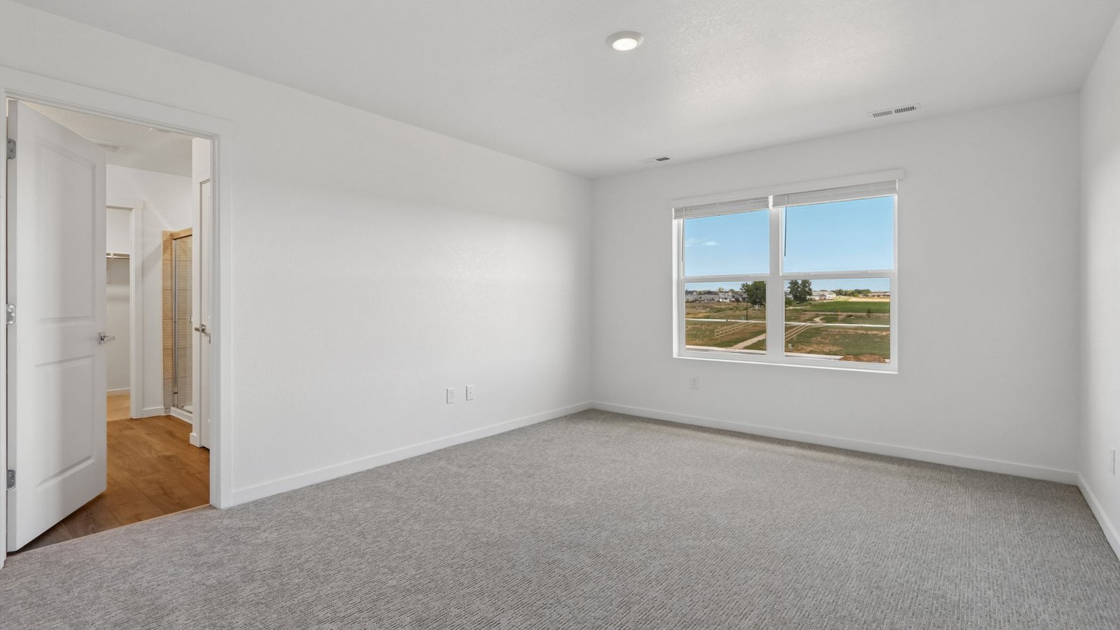 Light-filled owner's suite featuring generous square footage and comfort.