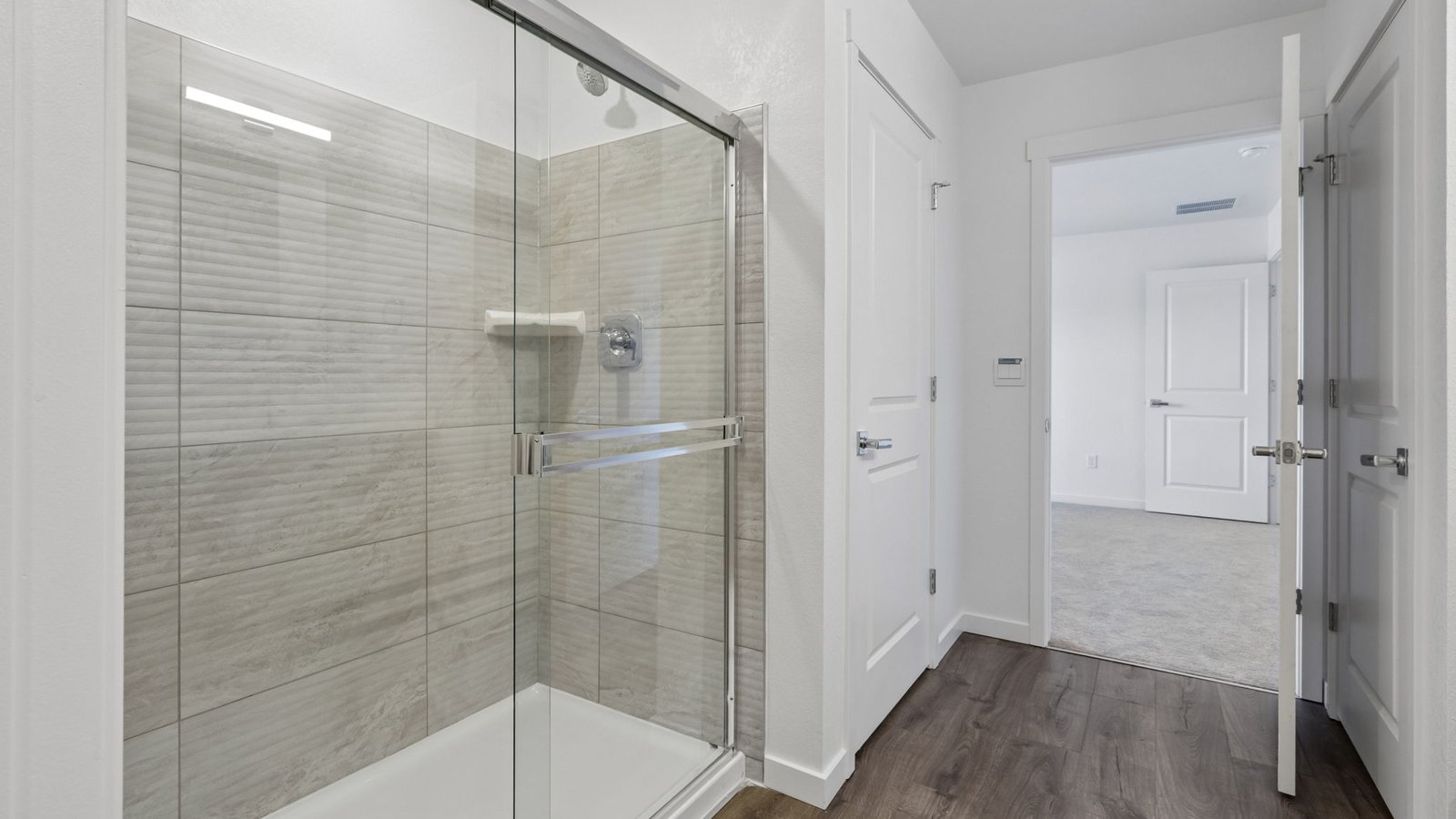 Contemporary ensuite bathroom with abundant counter space and stylish fixtures.