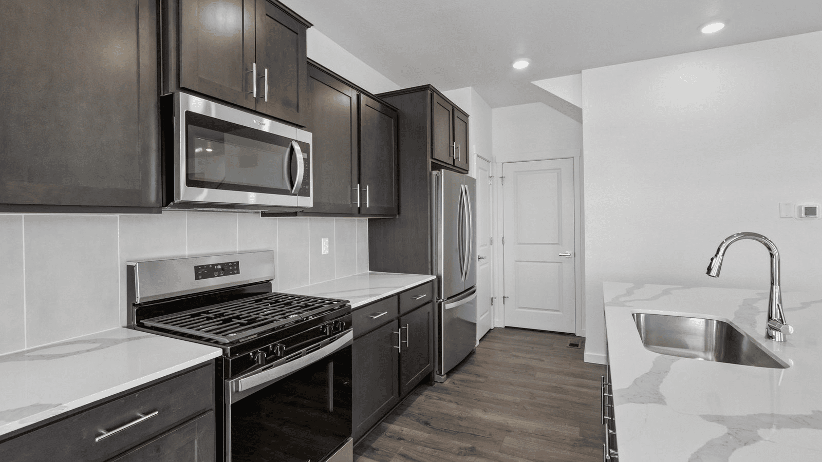 Open-concept kitchen designed for entertaining with oversized island seating.