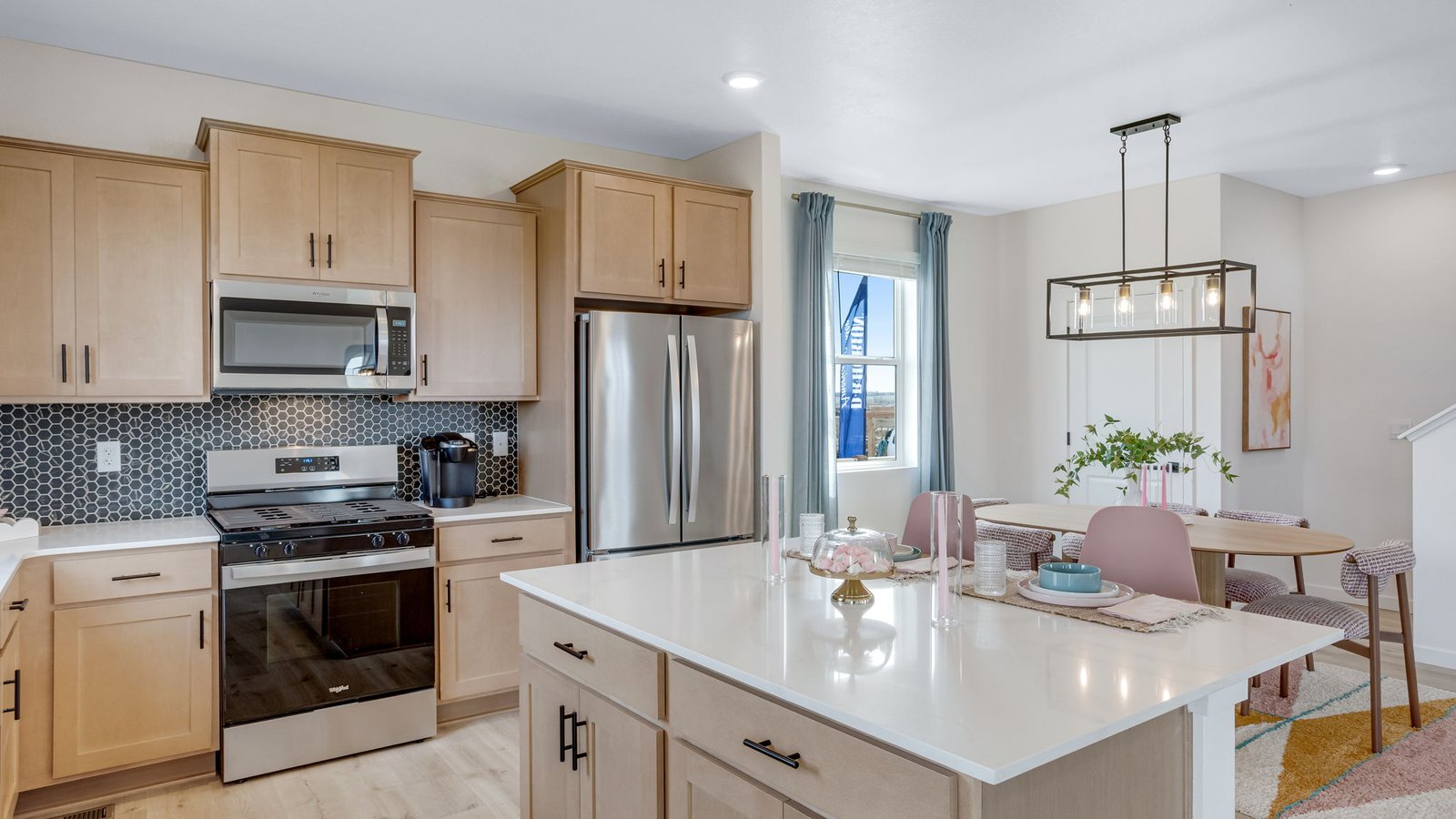 Modern kitchen with black hardware and large kitchen island Johnstown, CO