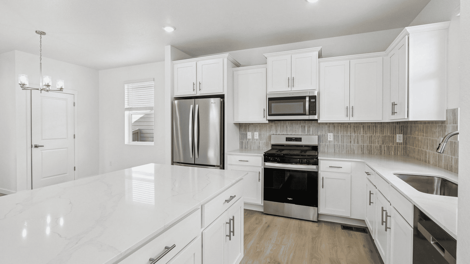 Spacious kitchen with new finishes in new home at Granary community