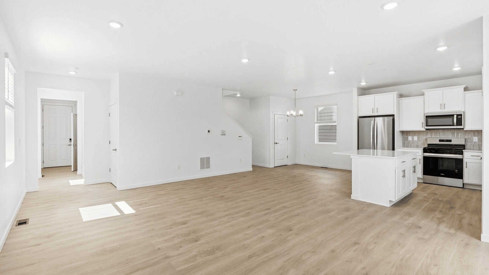 Secondary bedroom with large windows in new home at Granary Community