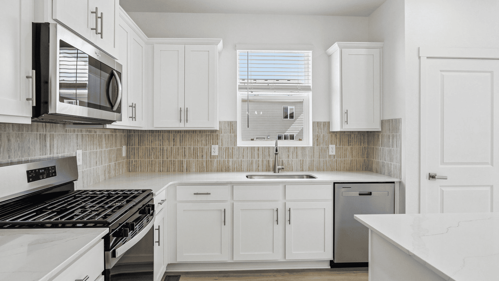 Kitchen with new appliances in home in Johnstown Colorado