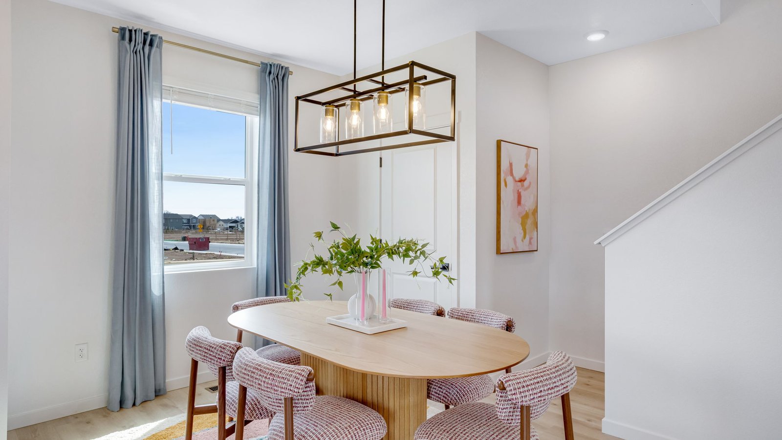 Dining area located next to kitchen in the Elder floorplan at the Granary community in Johnstown, CO.
