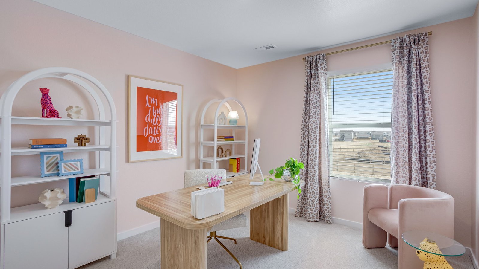 Secondary bedroom styled as a home office in a new construction Elder floorplan home in Johnstown, Colorado