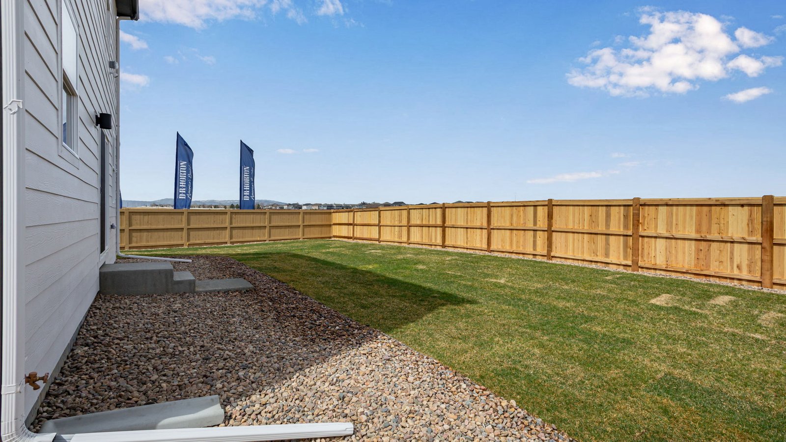 Exterior view of the Elder floorplan two‑story home with attached garage in the Granary community in Johnstown, Colorado.