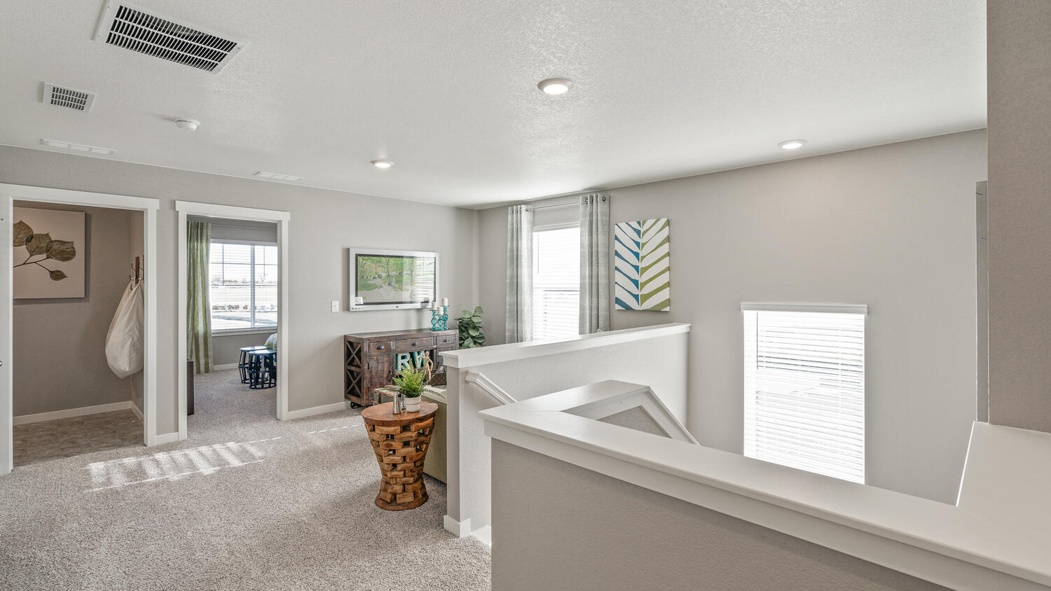 Spacious upstairs loft in the Hennessy floor plan offering additional room for work, play, or relaxation.