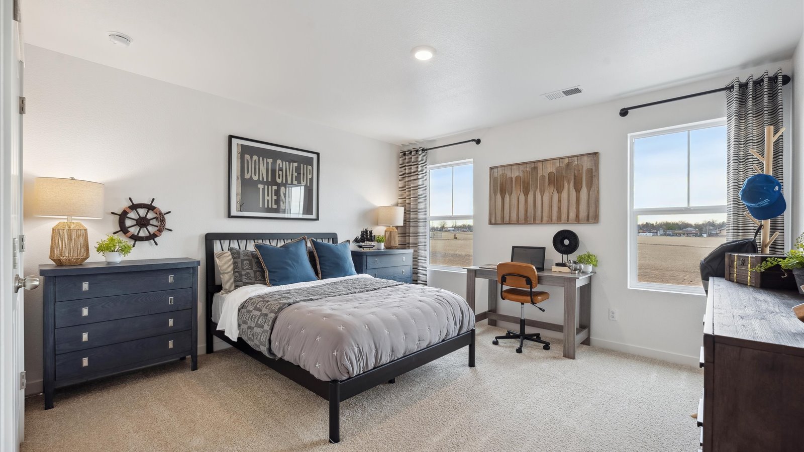 Secondary bedroom with large windows in new four bedroom home in Brighton Colorado