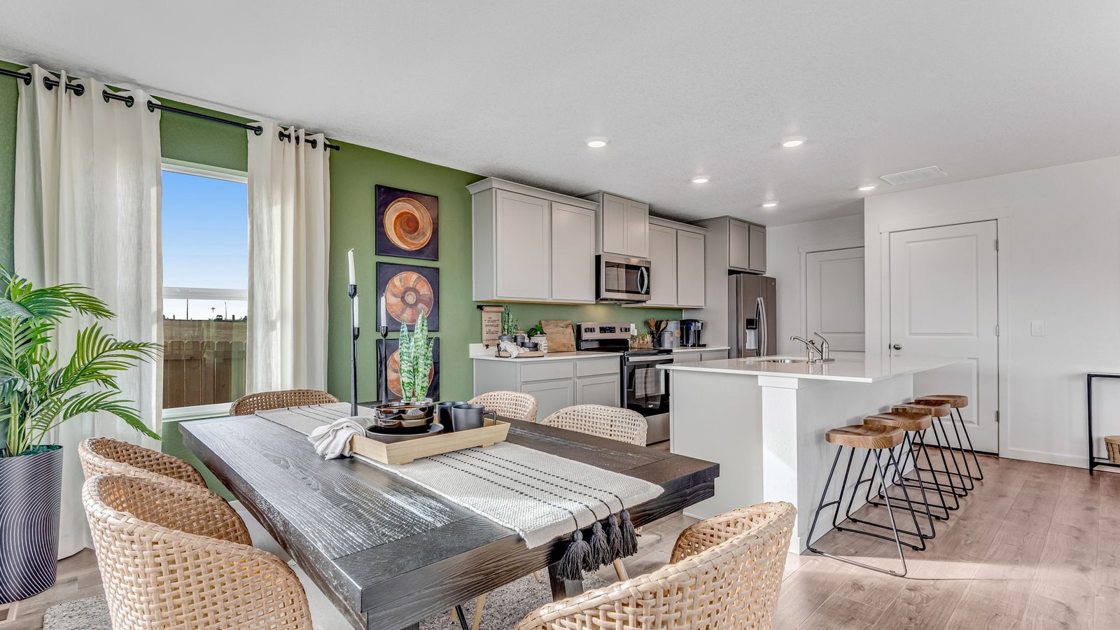 dining area and kitchen island in D.R. Horton new construction home near brighton colorado