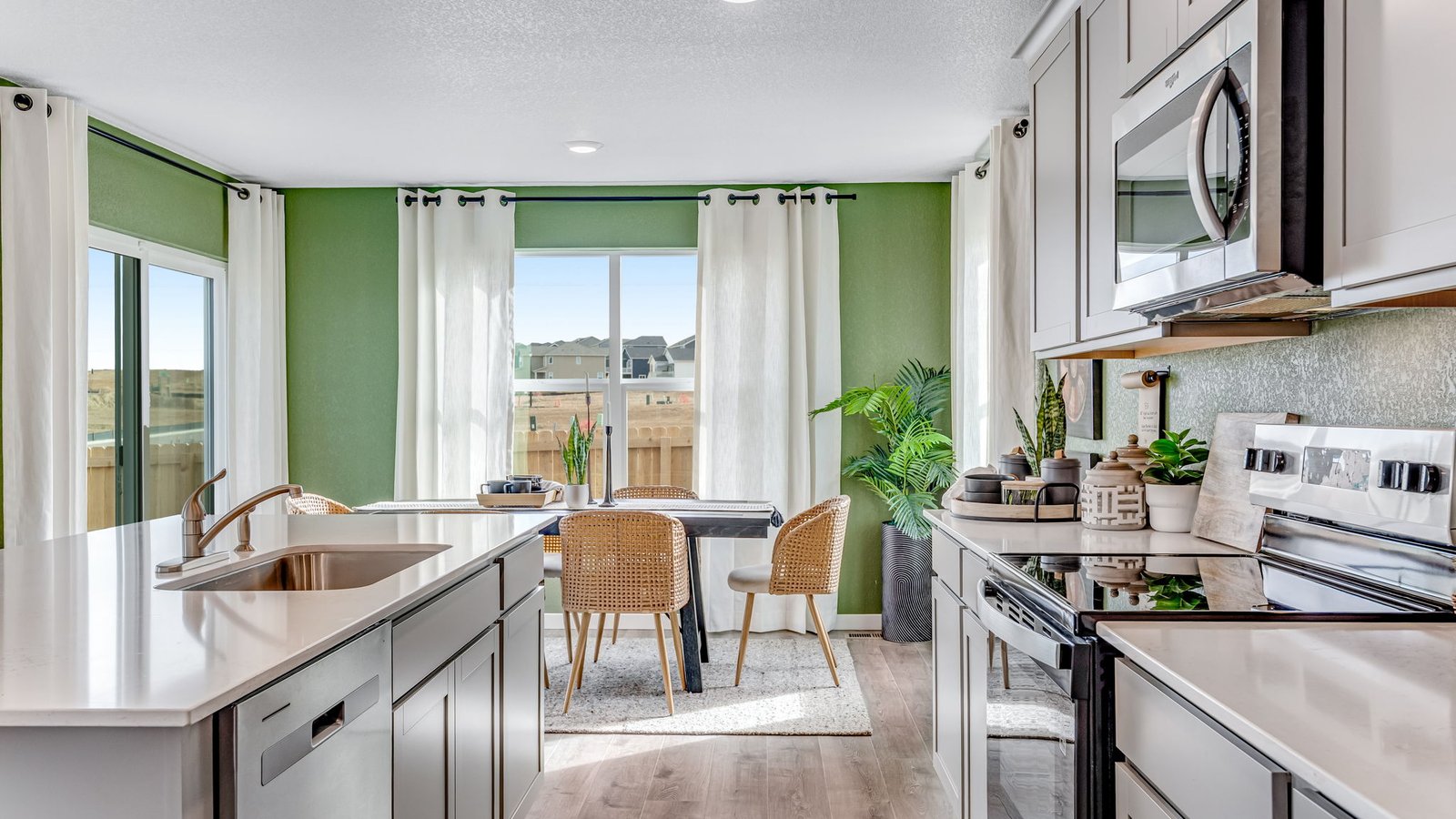 Open kitchen with quartz countertops, pendant lighting, and a spacious island for entertaining.