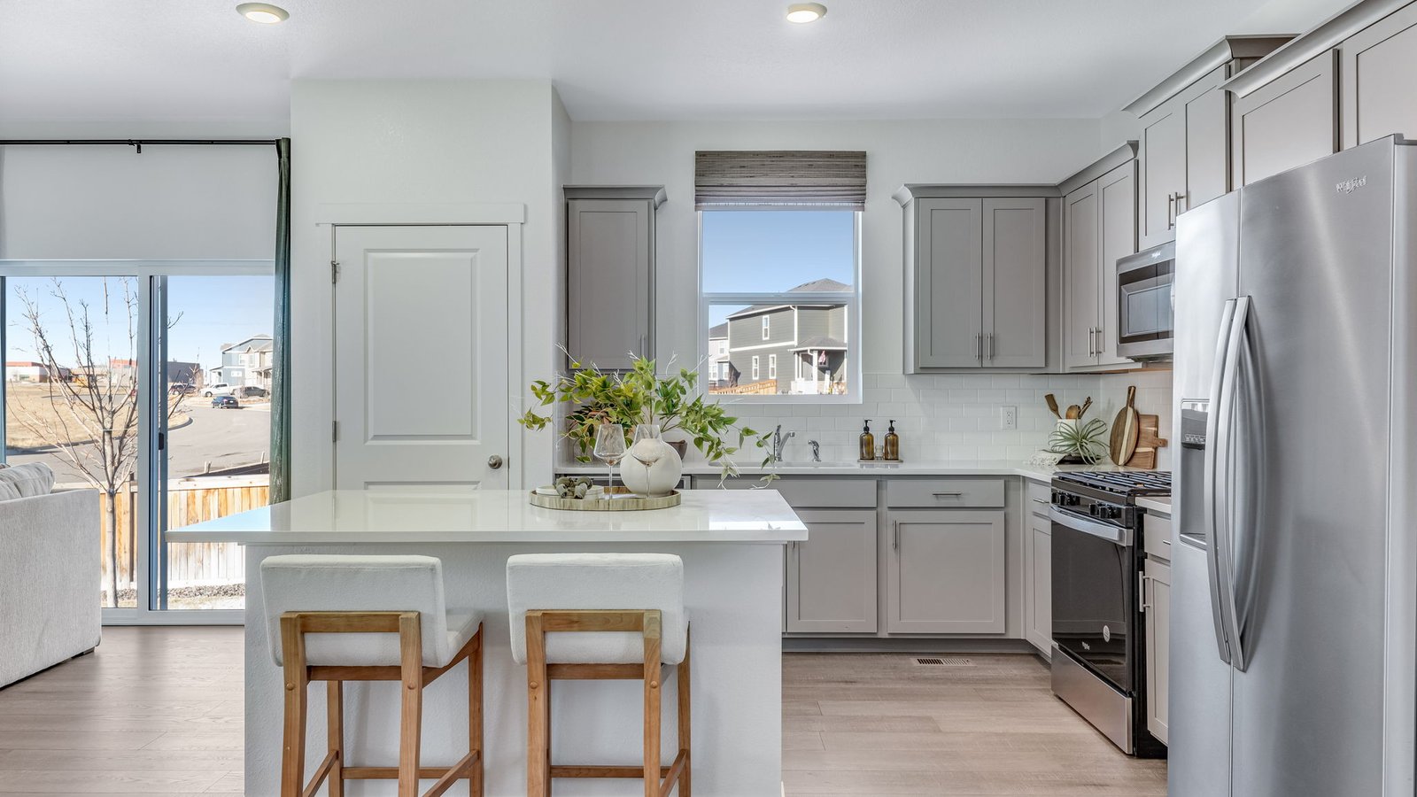 kitchen with stainless steel appliances of new model home by d.r. horton colorado
