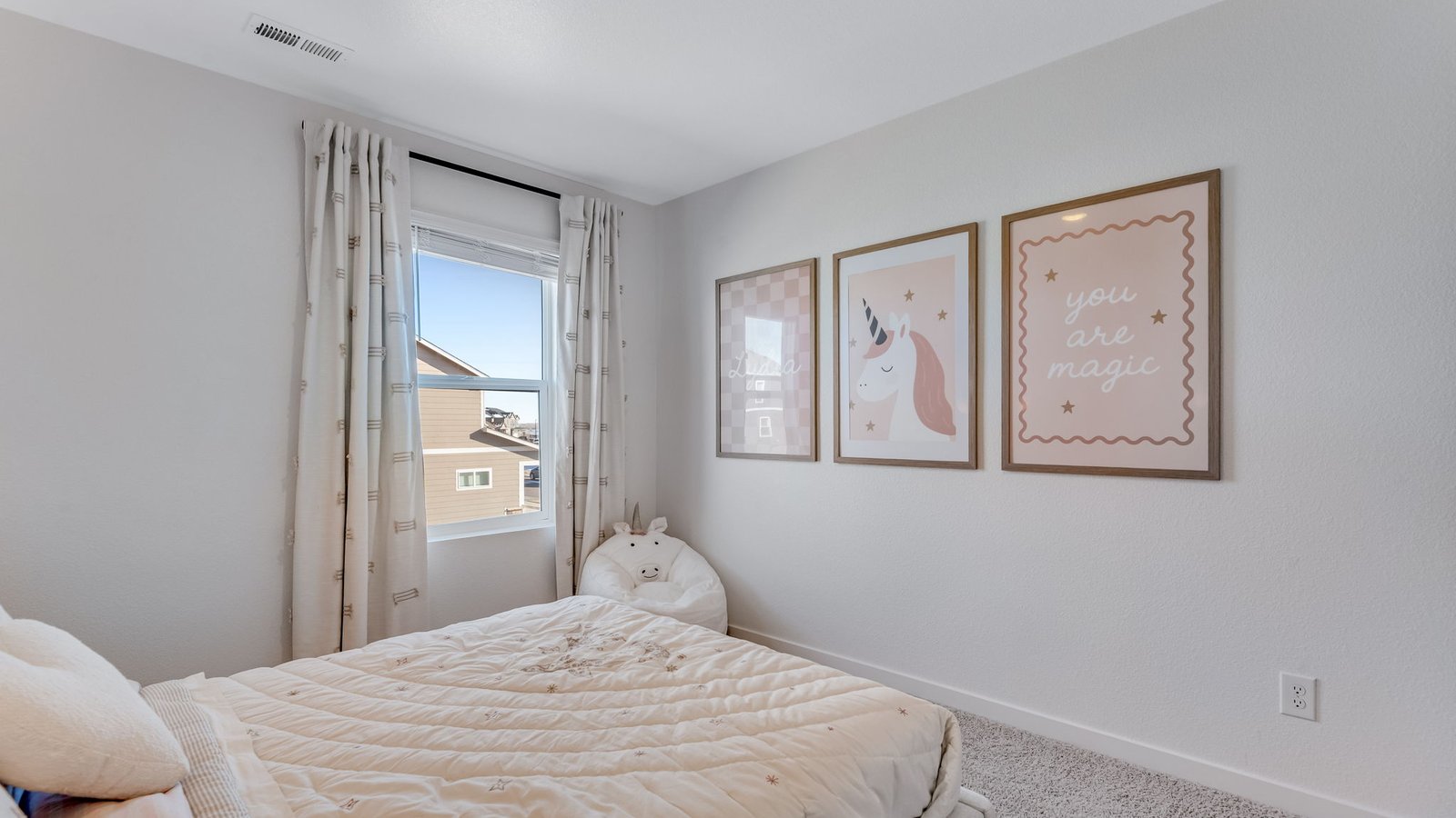 pink girl bedroom of model home by d.r. horton colorado