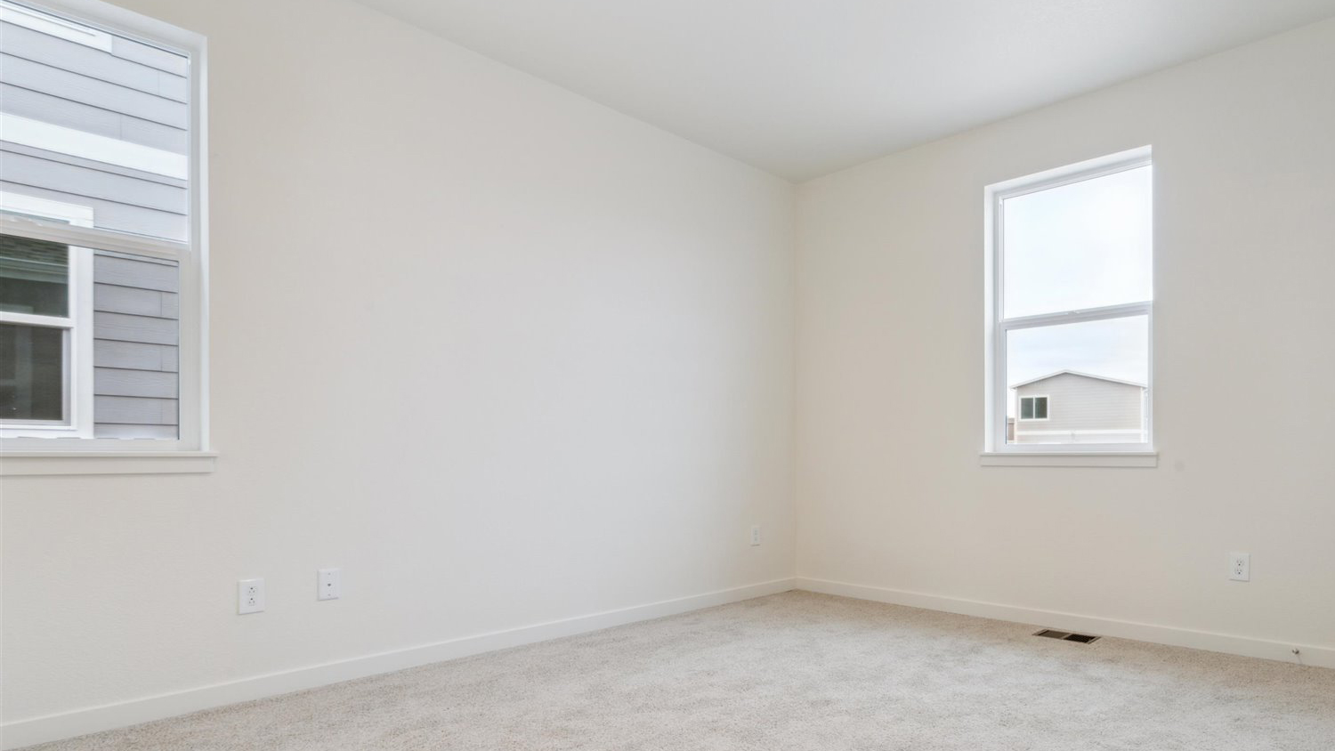 Bedroom with large windows in new D.R. Horton home at Silver Peaks Community in Lochbuie Colorado