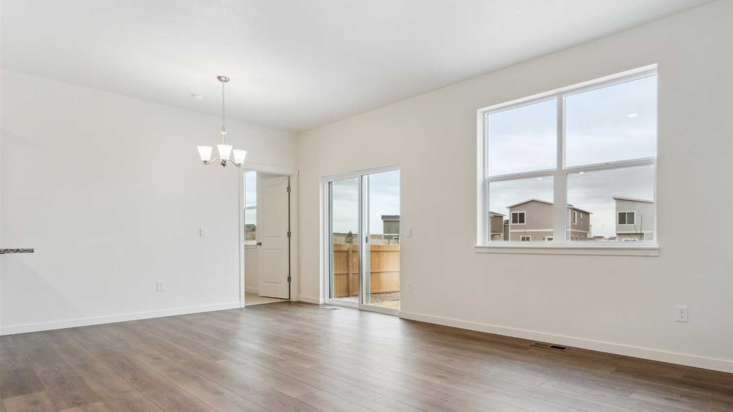 Great room with large windows in new D.R. Horton home in Lochbuie Colorado
