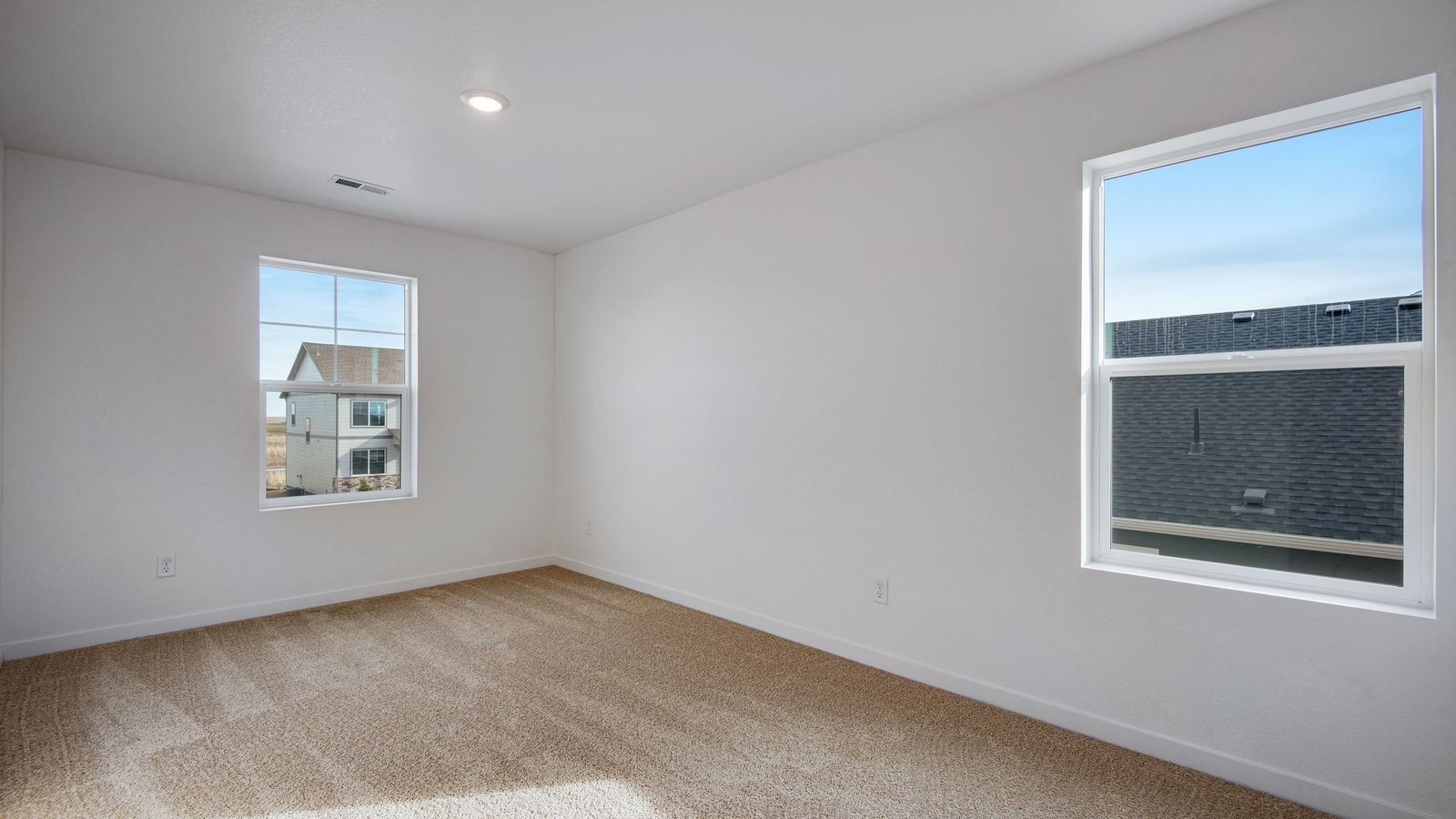 Secondary bedroom in Lochbuie Colorado at new home community Silver Peaks