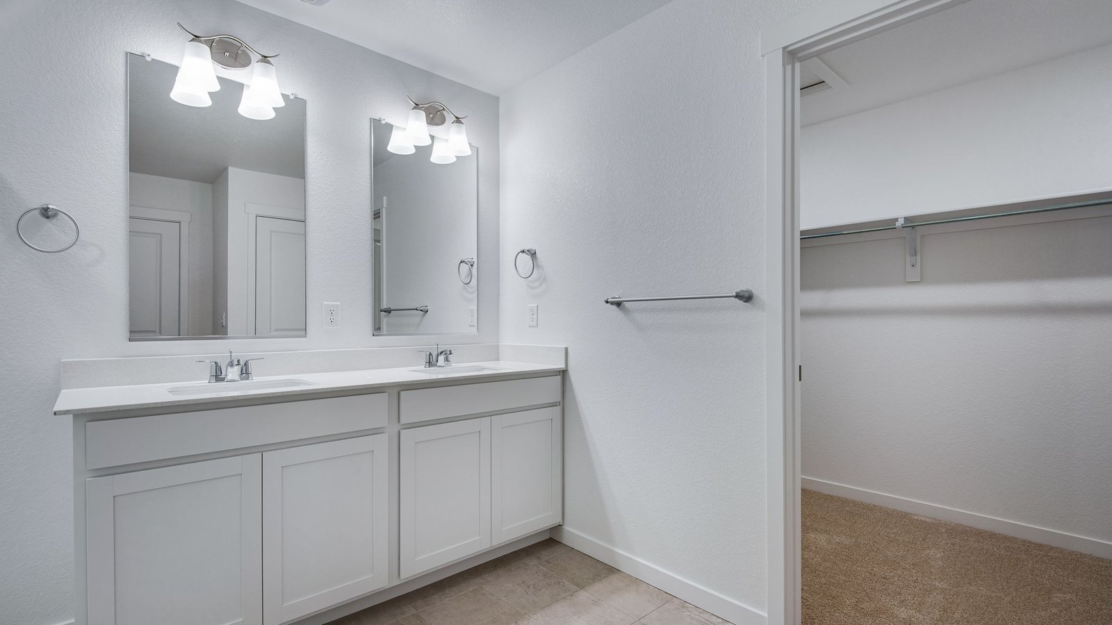 Private attached bathroom with dual sink vanity in Silver Peaks Community