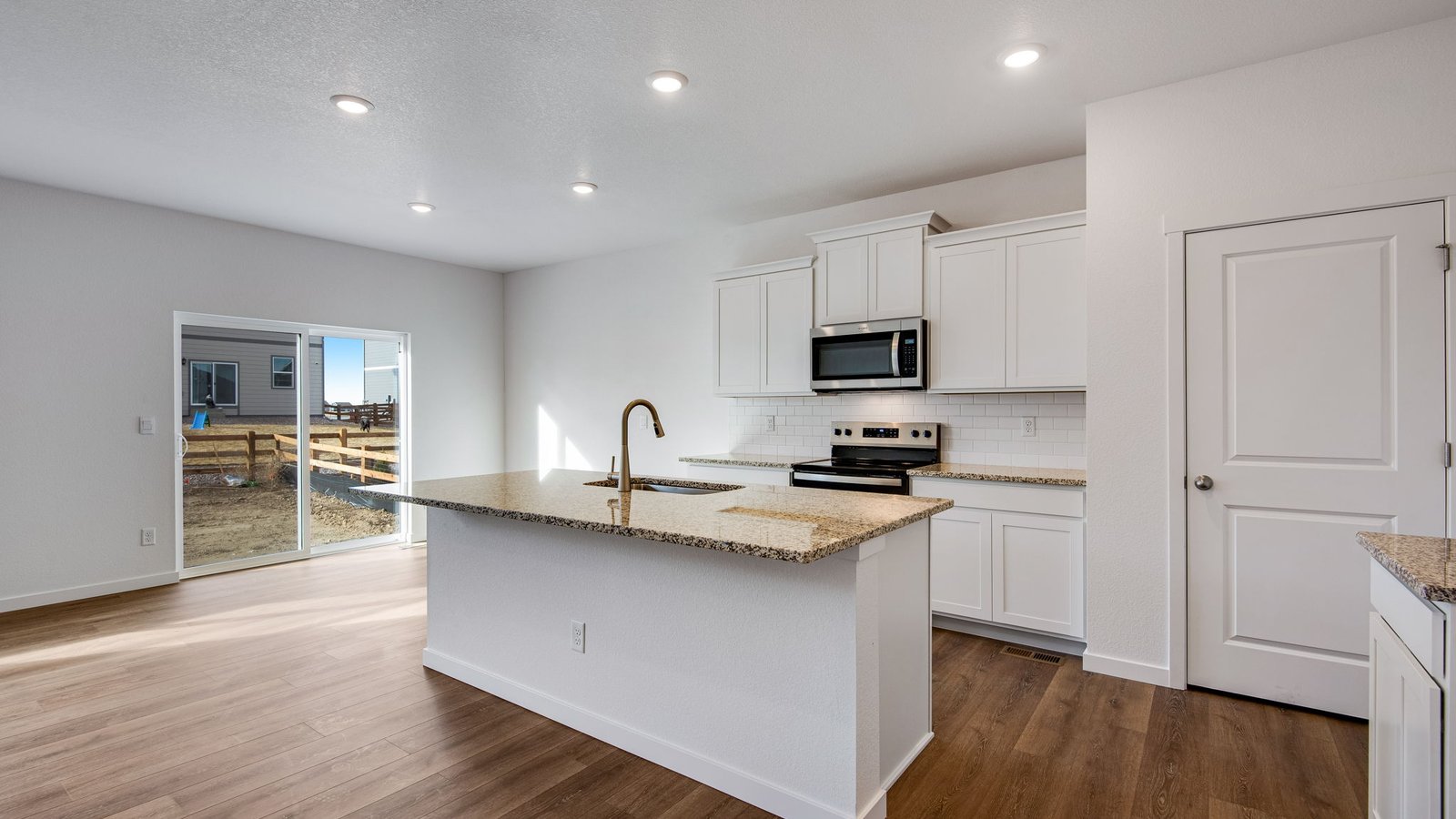 Kitchen with new finishes in new D.R. Horton home in Brighton, Colorado
