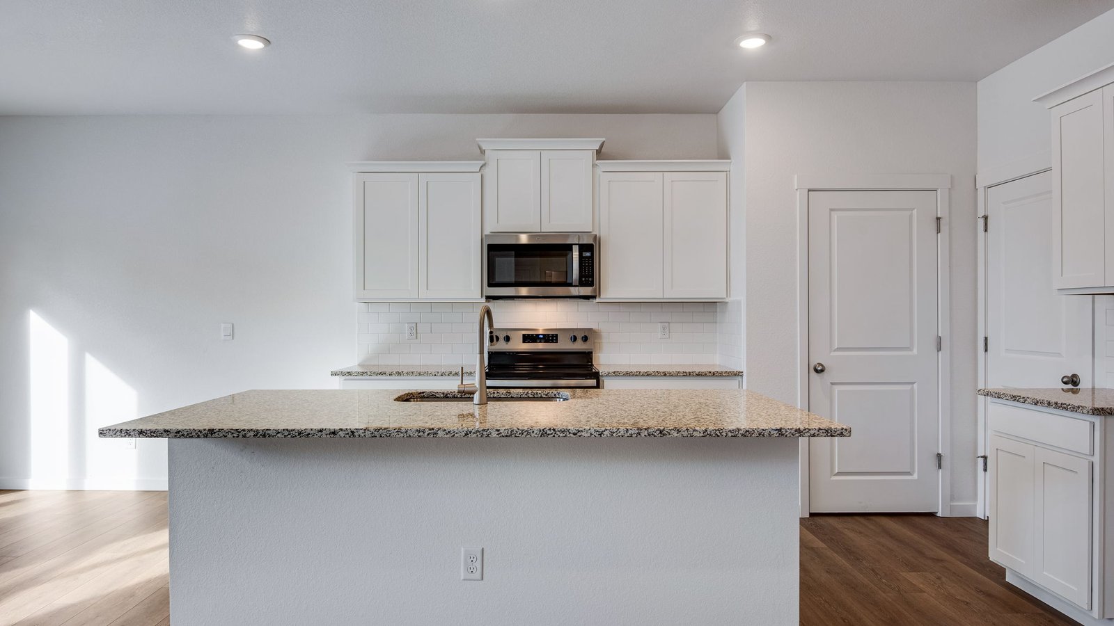 Spacious kitchen with new finishes in new D.R. Horton home in Lochbuie Colorado