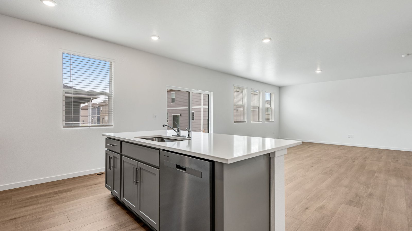 Spacious kitchen island great for entertaining in new home in Lochbuie Colorado
