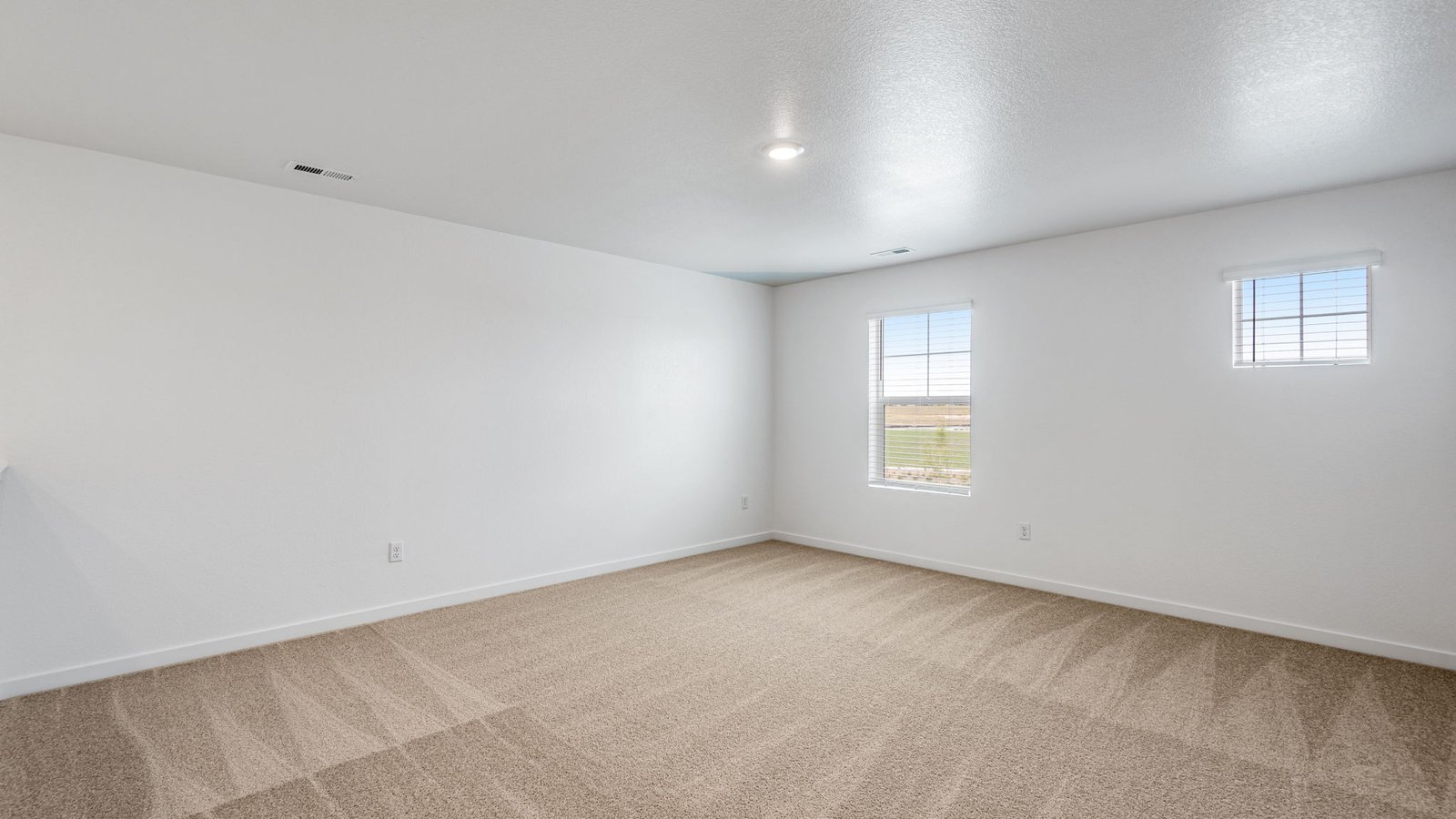 Spacious primary bedroom in new home in Lochbuie Colorado