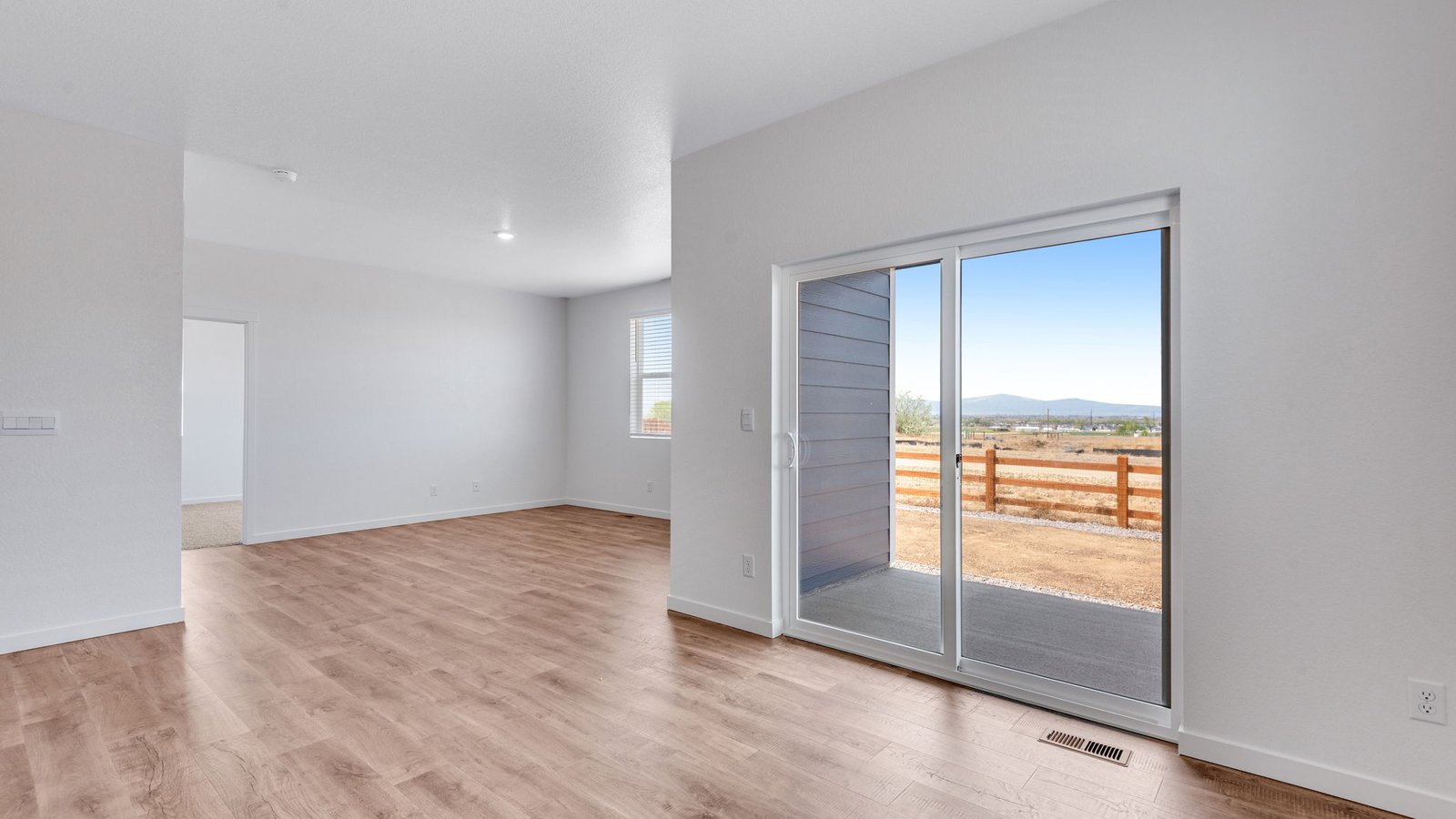 Dining space in the Chatham home with natural light and convenient patio access.