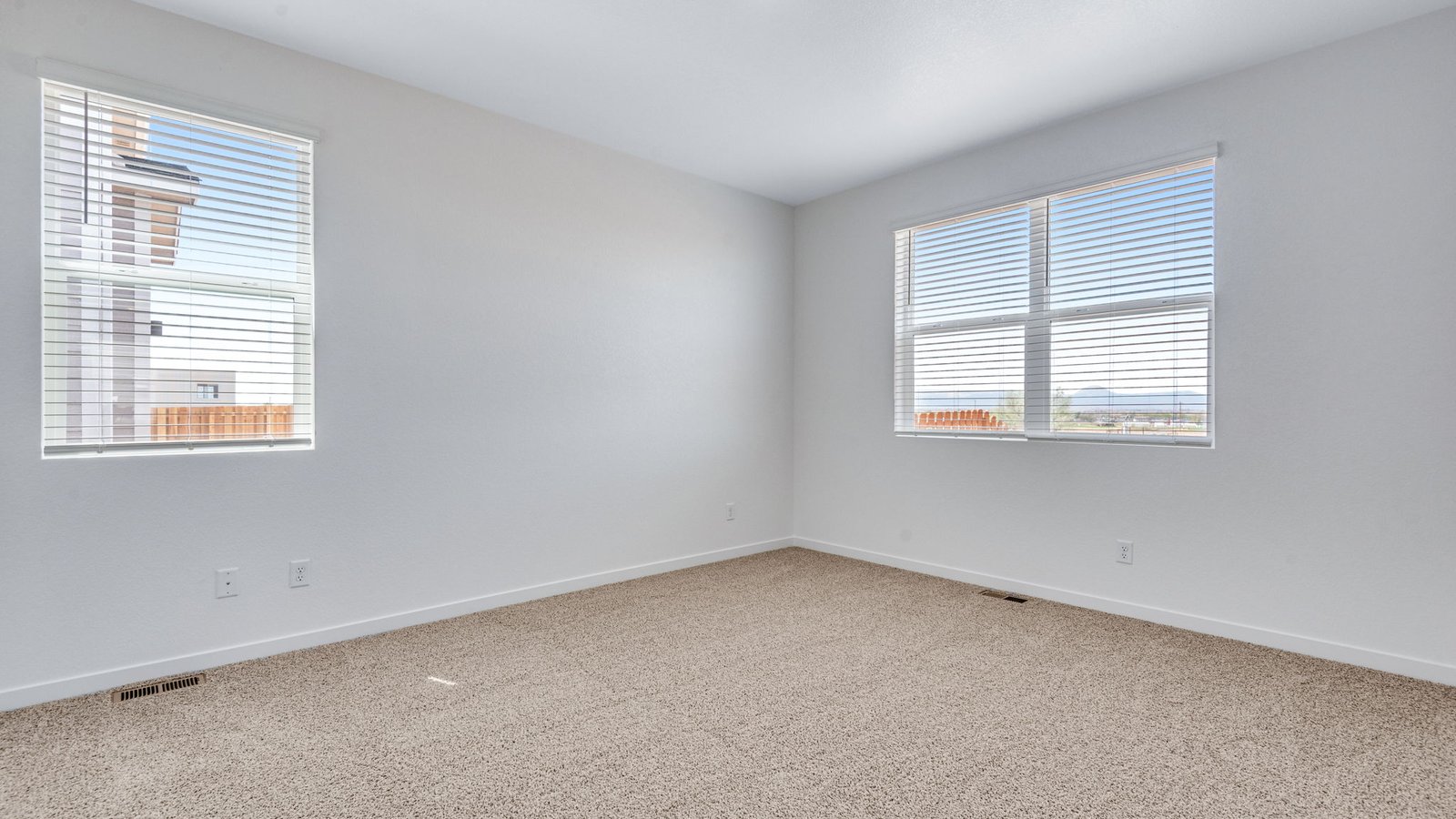 Bright and spacious primary suite in the Chatham ranch-style home at Fossil Creek Ranch.