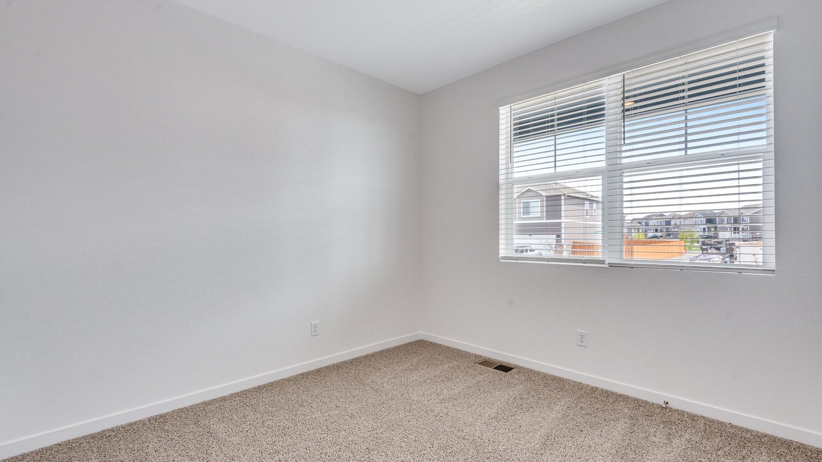 Secondary bedroom in the Chatham floor plan at Fossil Creek Ranch with flexible living space and natural light.