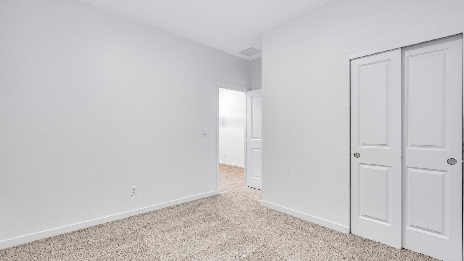 Versatile bedroom in the Chatham floor plan with natural light and functional design.