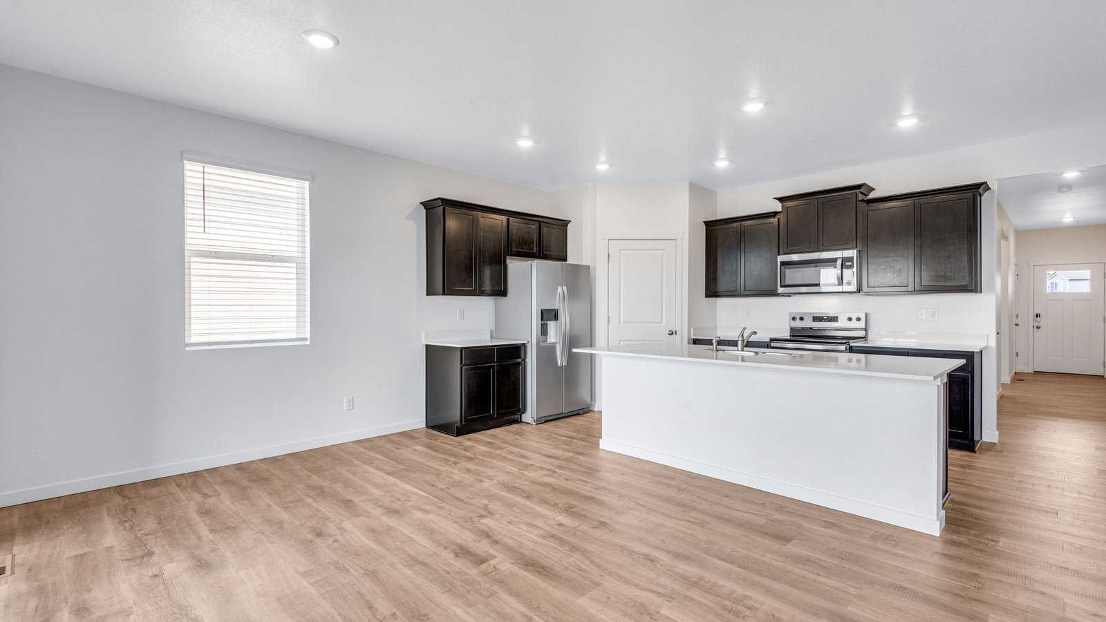 Open-concept kitchen in the Chatham home with premium cabinetry, spacious island, and contemporary finishes.