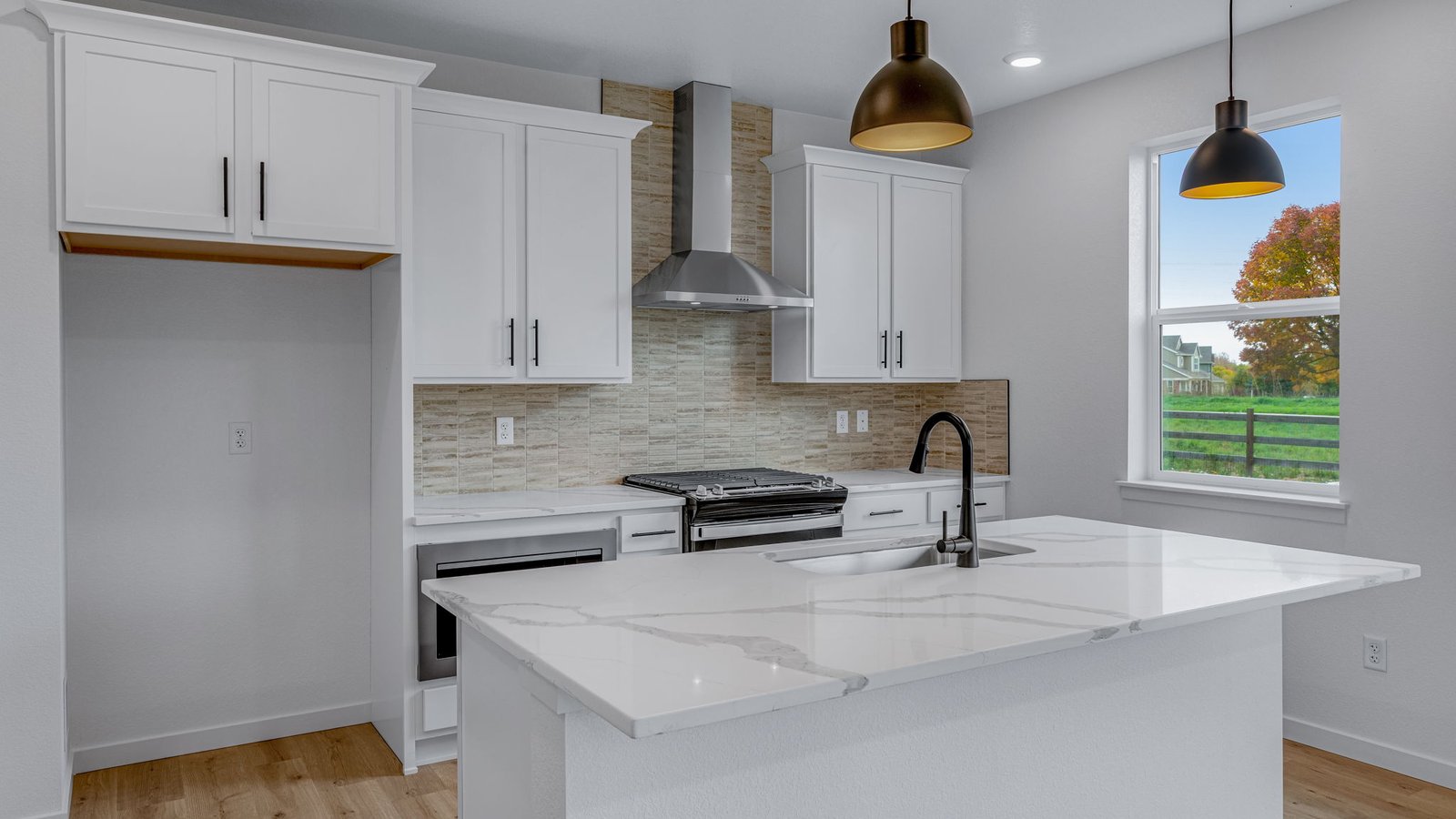 large black pendants in new construction kitchen in windsor, co home