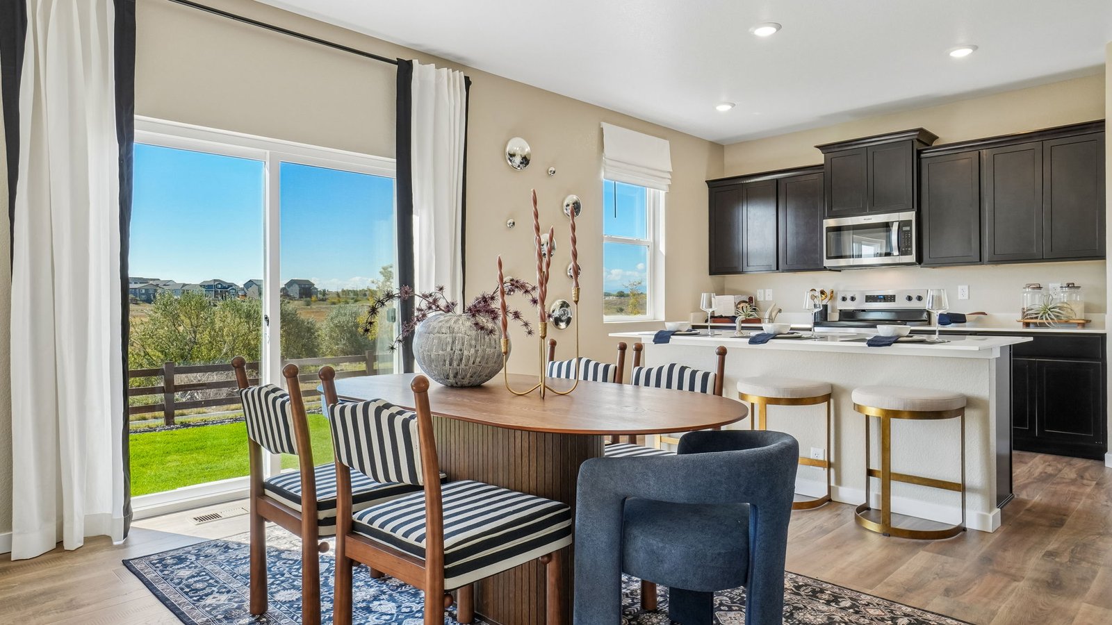 Gourmet kitchen with quartz countertops, stylish cabinetry, and a large center island.