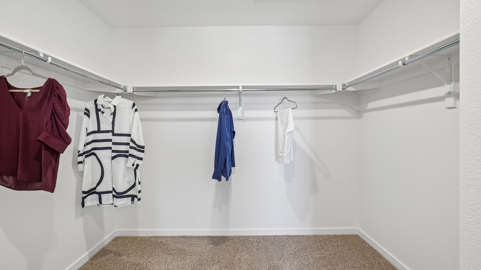 Oversized walk-in closet in the primary suite offering exceptional storage space.