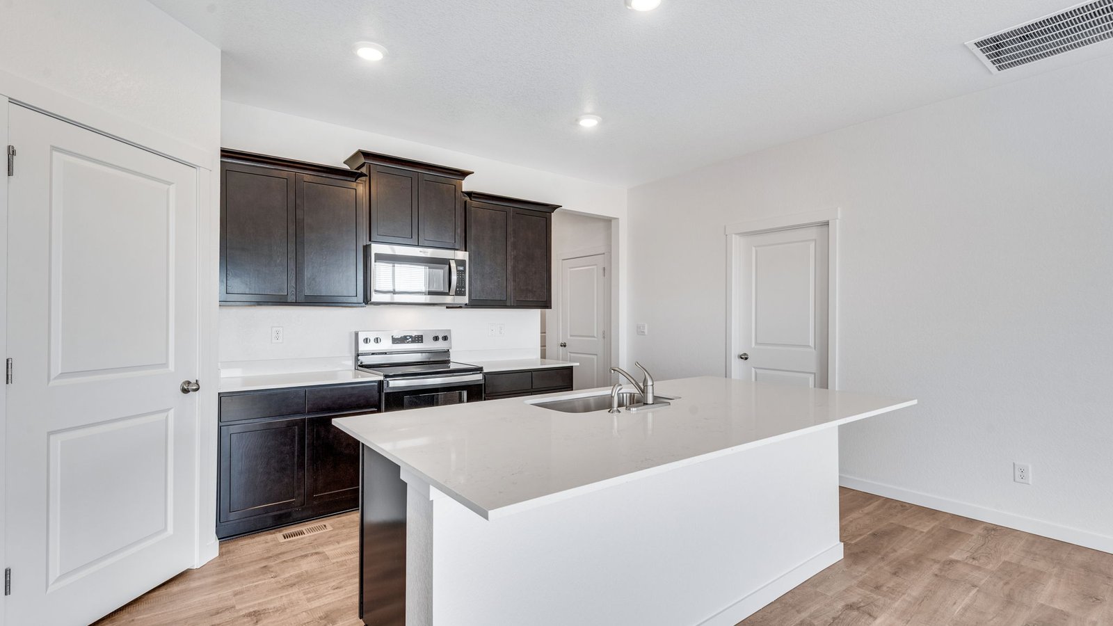 Kitchen island perfect for entertaining in new home in Mead Colorado