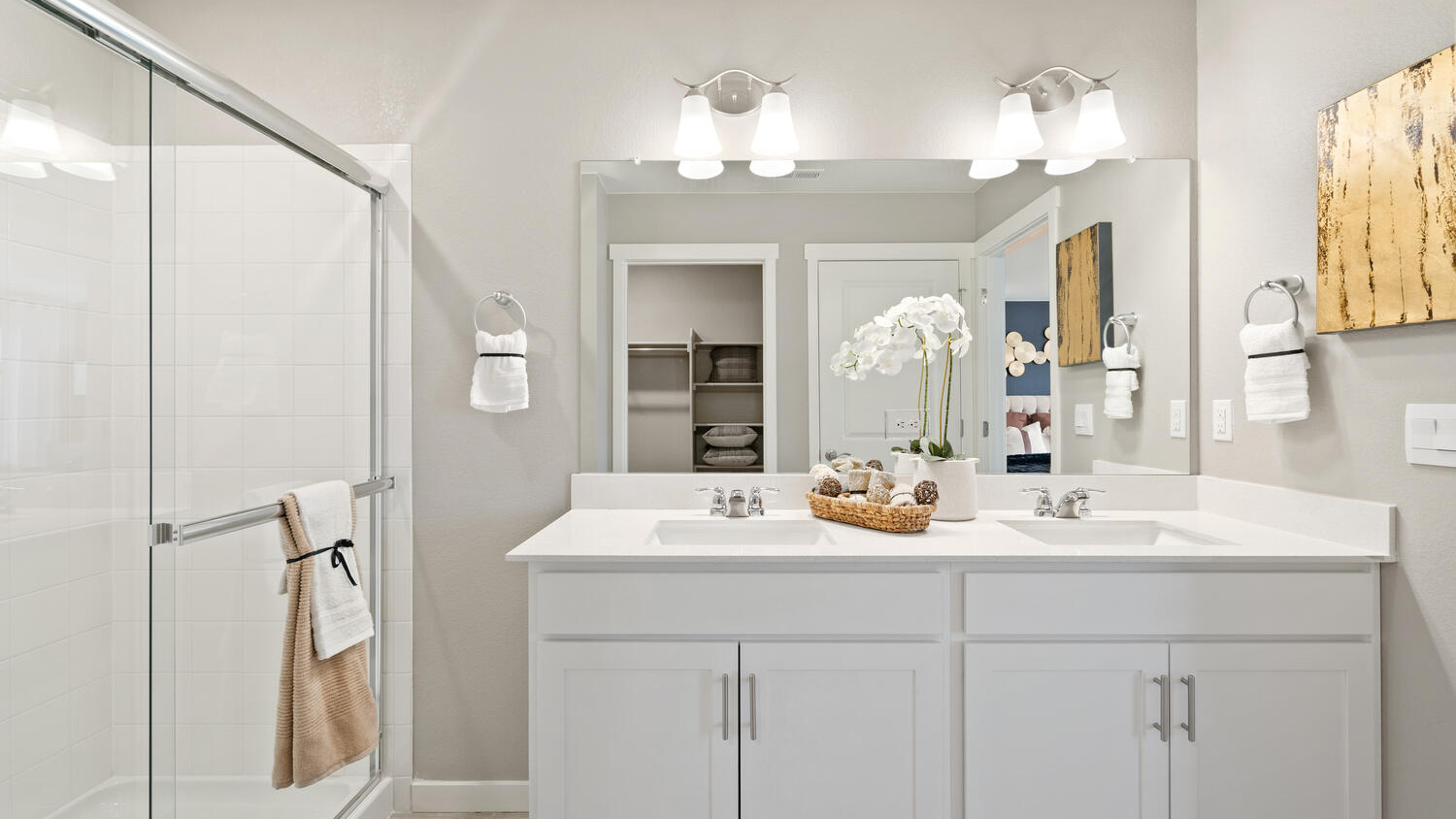 Private primary bathroom with dual sink vanity in new D.R. Horton home