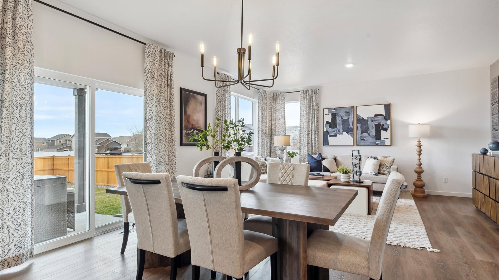 Dining area connected to kitchen in Mead new construction home