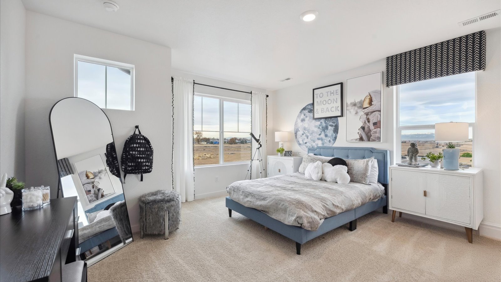 Secondary bedroom with large windows in new D.R. Horton home at Lakeside Canyon community