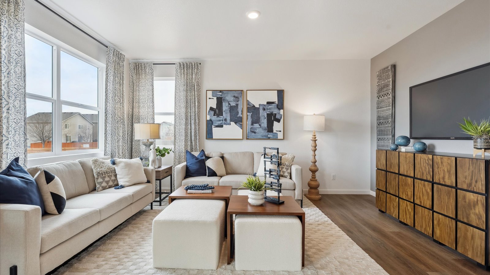 Living room with large windows in new home in Mead, Colorado