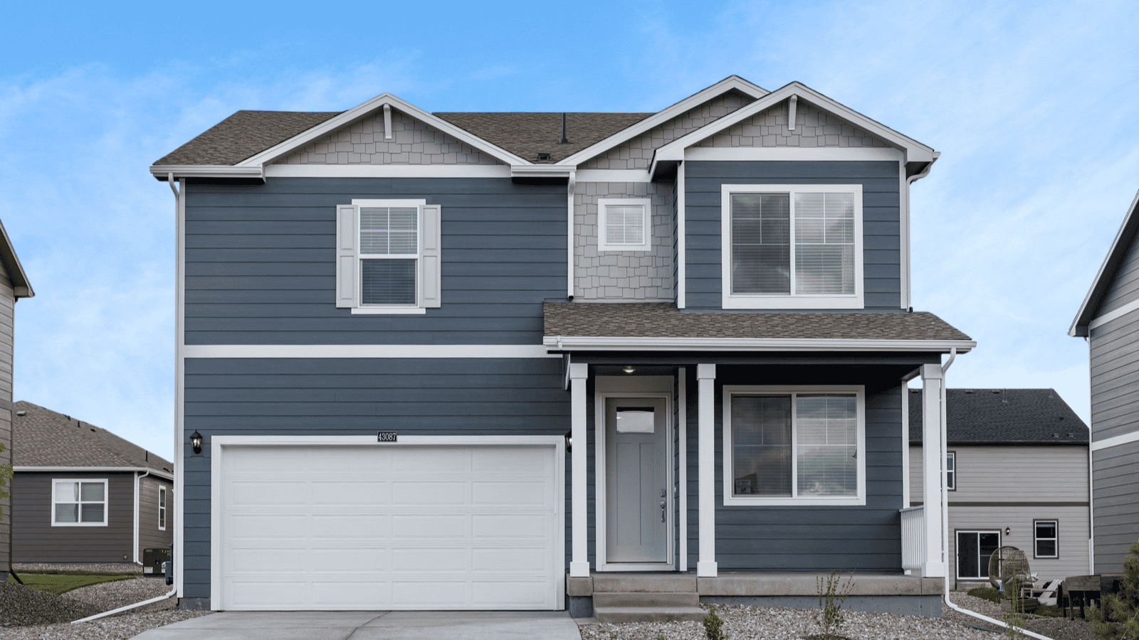 Exterior of two story Holcombe floor plan of new home in Lakeside Canyon community