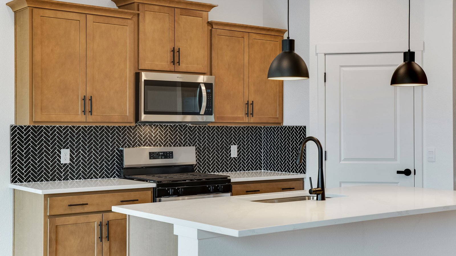 Spacious kitchen with new finishes in new home in Mead, Colorado