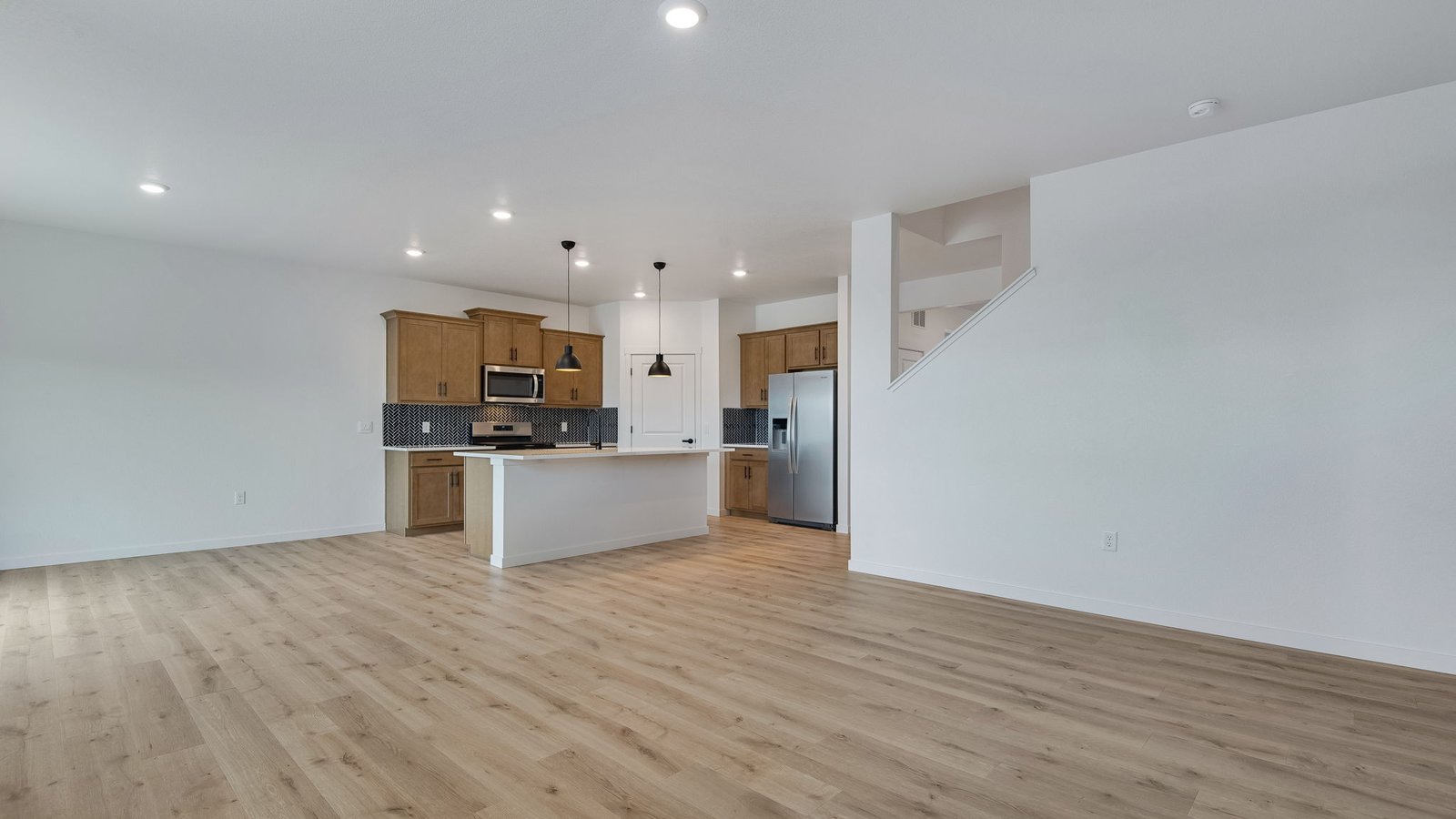 Open concept first floor living in new home at Lakeside Canyon