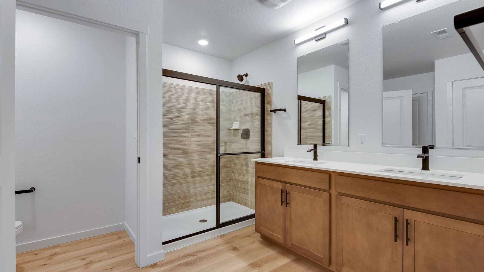 Primary bathroom with dual vanity sinks in new home in Colorado