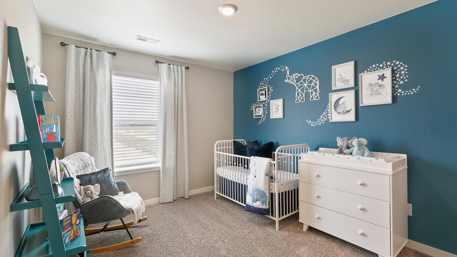 Secondary bedroom with large windows in Mead, Colorado new home