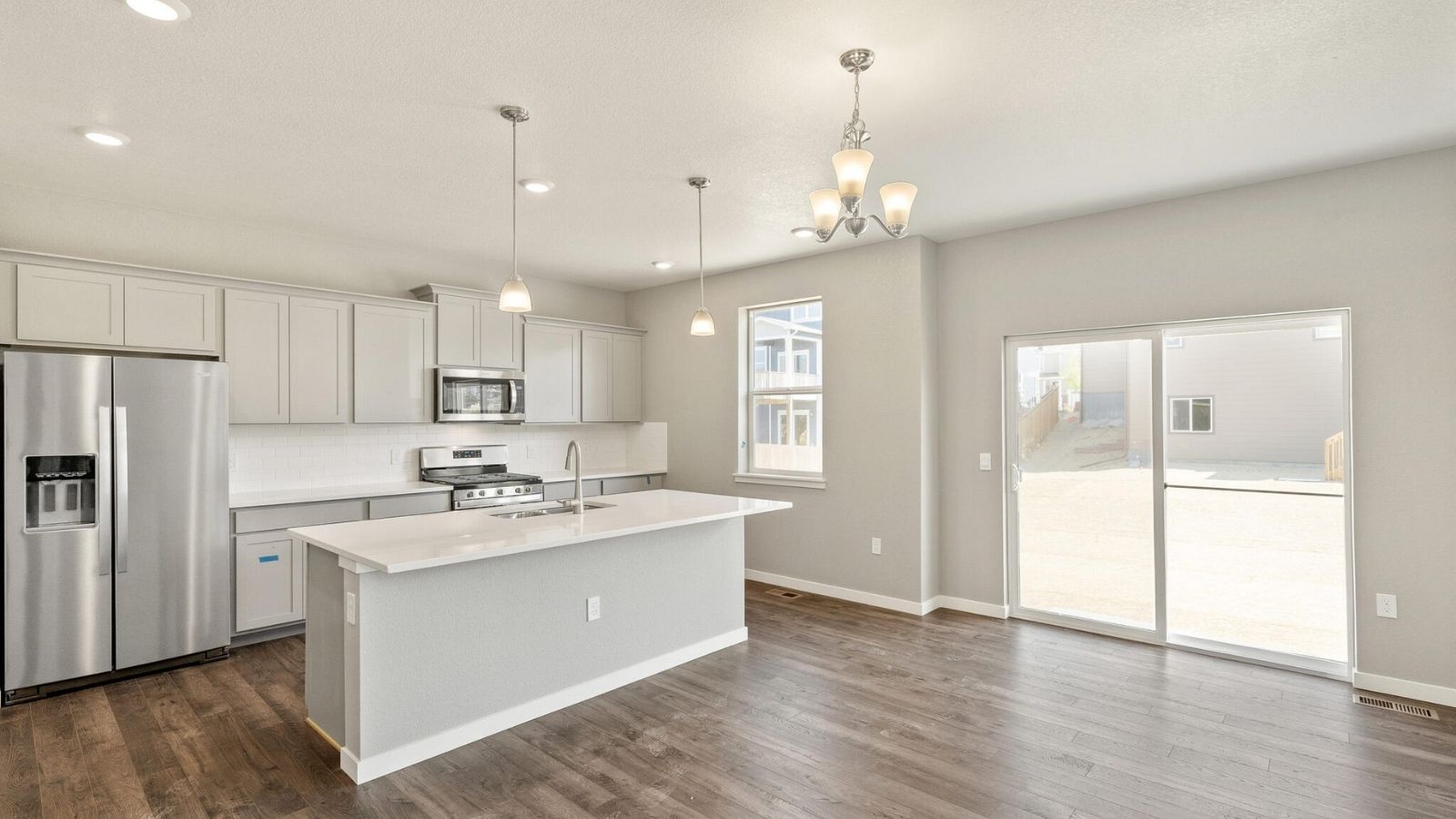 Spacious kitchen with large windows in new D.R. Horton Bridgeport floorplan