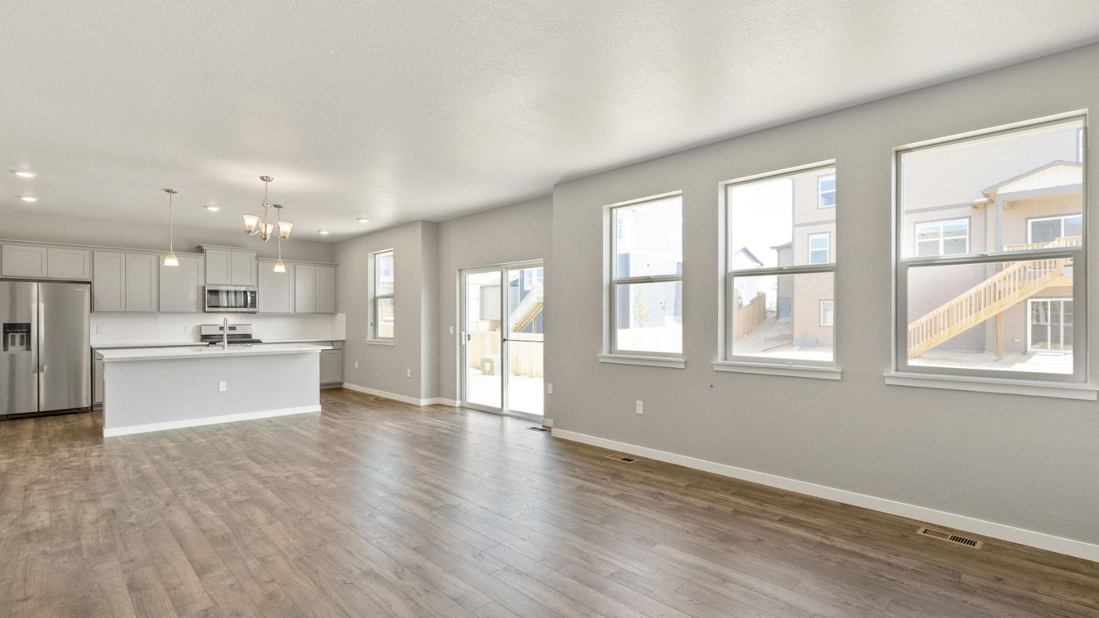 Large windows in open concept great room of new home in Mead, Colorado