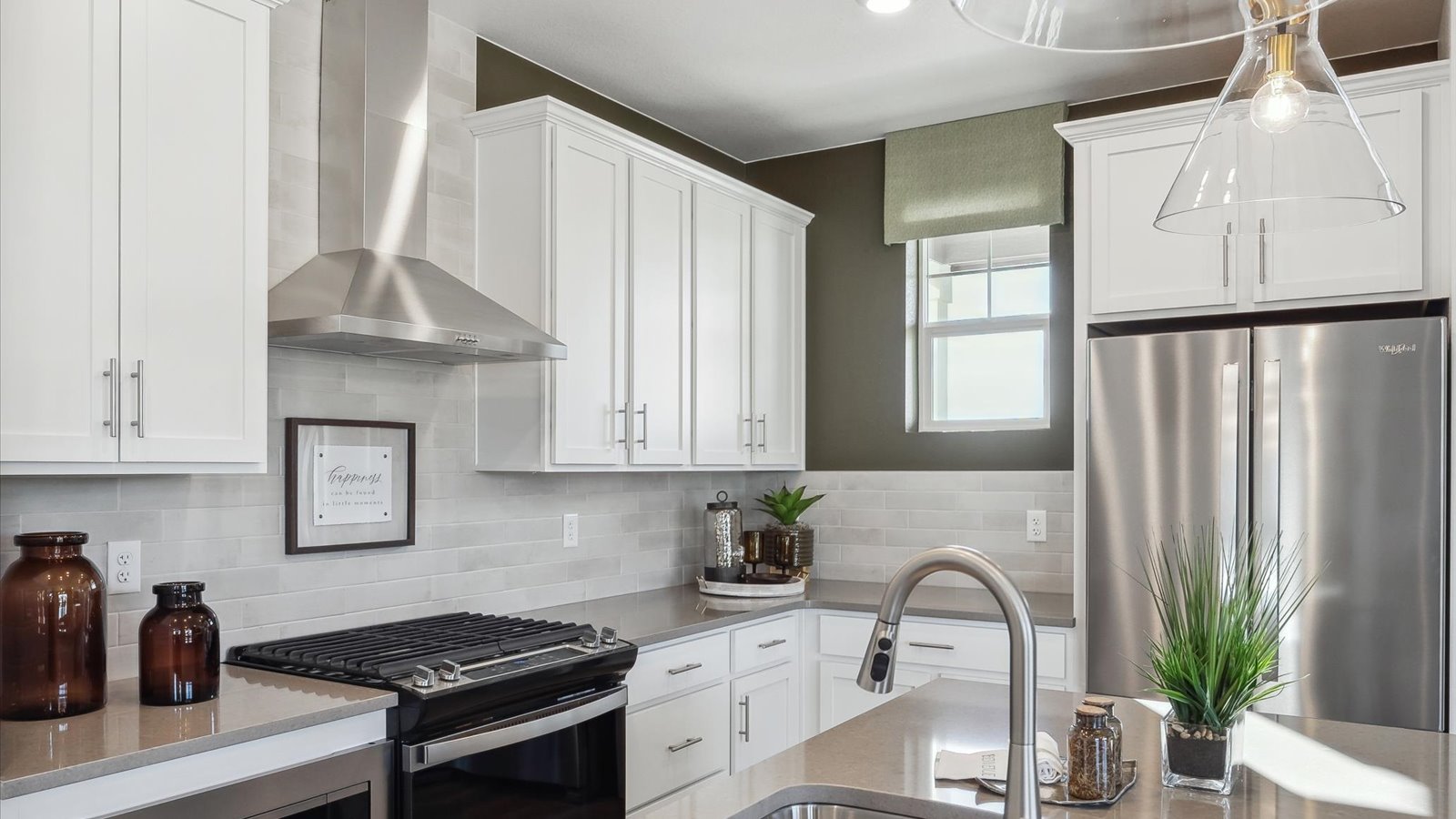 Chef-inspired kitchen in Muirfield plan with large island and sleek cabinetry