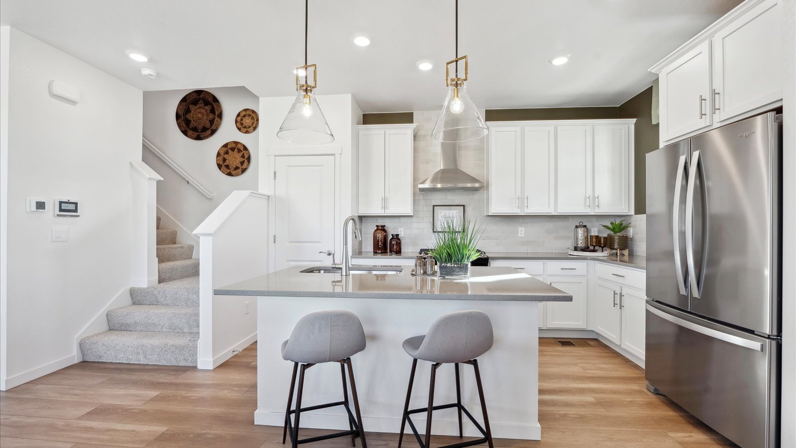 Open dining space connected to kitchen in Muirfield home design