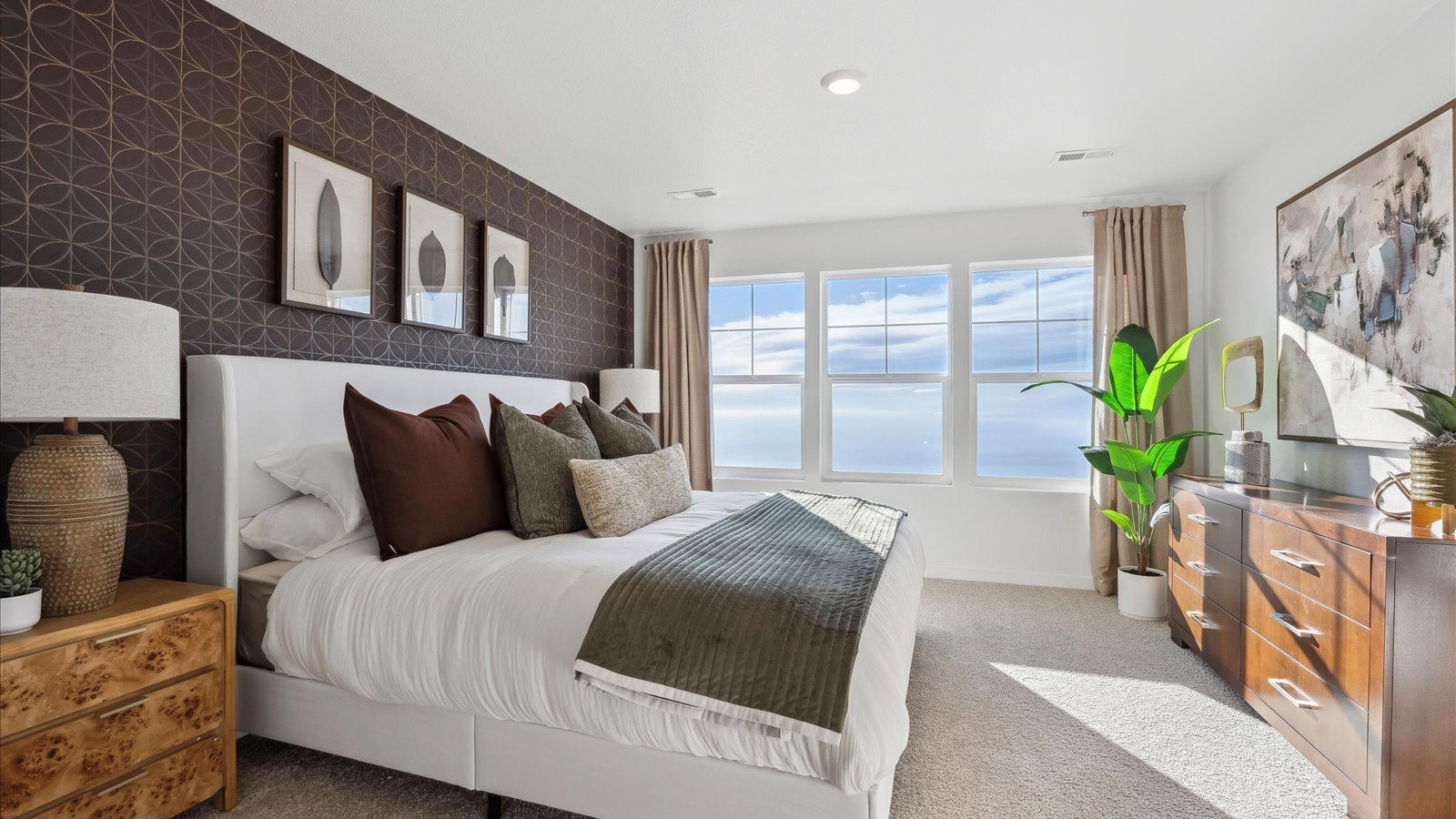 Primary suite in Muirfield floor plan with large windows and comfortable layout