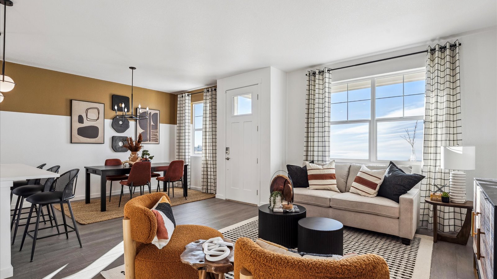 Bright Vail great room with contemporary design, comfortable gathering space, and views toward the kitchen and dining area.
